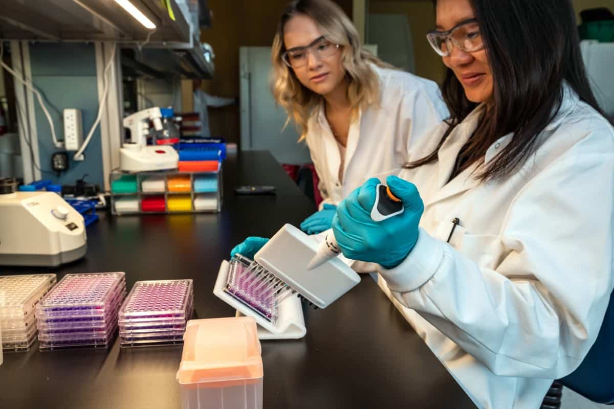 Crestone biotech company in Boulder, Colorado team members in a lab doing C. difficile research.