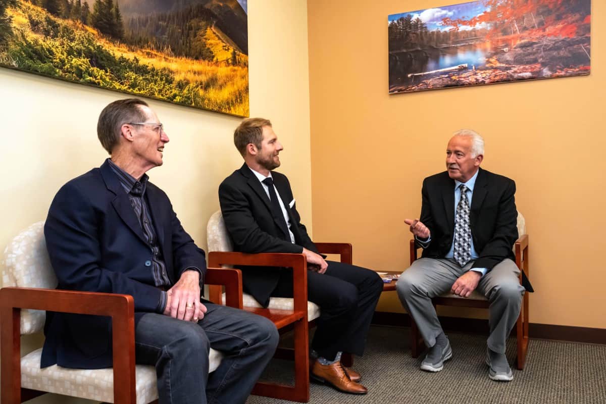 Staff at Colorado biotechnology company discussing C. diff research and antibiotic development.